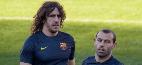 Carles Puyol y Javier Mascherano en entrenamiento con Barcelona - AFP